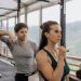 A fit couple engaged in gym exercises. Indoor workout with focus on fitness goals.